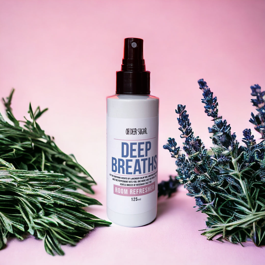 a spray bottle of room refresher scented in  a calming blend called deep breaths